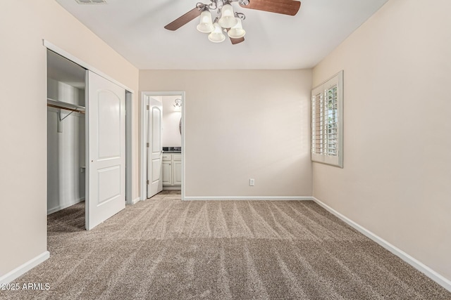 2807 N 8th Ave, Phoenix, AZ 85007 - unfurnished bedroom featuring carpet floors, baseboards, a closet, and ceiling fan