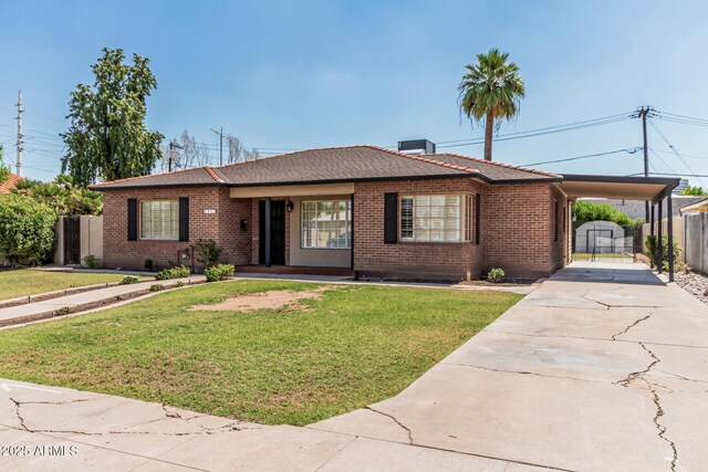2807 N 8th Ave, Phoenix, AZ 85007 - single story home featuring concrete driveway, brick siding, an attached carport, and covered porch
