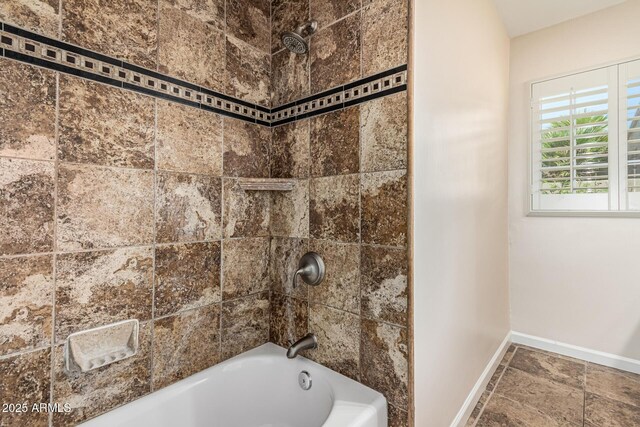2807 N 8th Ave, Phoenix, AZ 85007 - bathroom featuring baseboards and  shower combination