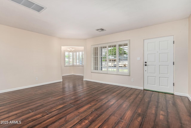 2807 N 8th Ave, Phoenix, AZ 85007 - foyer with a chandelier, dark wood-style floors, and baseboards
