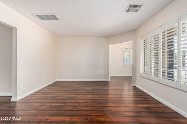 2807 N 8th Ave, Phoenix, AZ 85007 - unfurnished room featuring hardwood / wood-style flooring, a chandelier, and baseboards