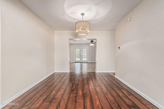 2807 N 8th Ave, Phoenix, AZ 85007 - unfurnished room with a chandelier, wood finished floors, and baseboards