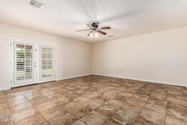 2807 N 8th Ave, Phoenix, AZ 85007 - empty room with ceiling fan, baseboards, and stone finish floors