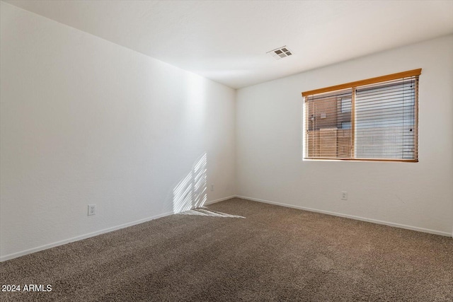 empty room featuring carpet floors