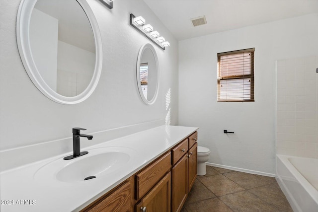 full bathroom featuring toilet, vanity, tile patterned floors, and tub / shower combination