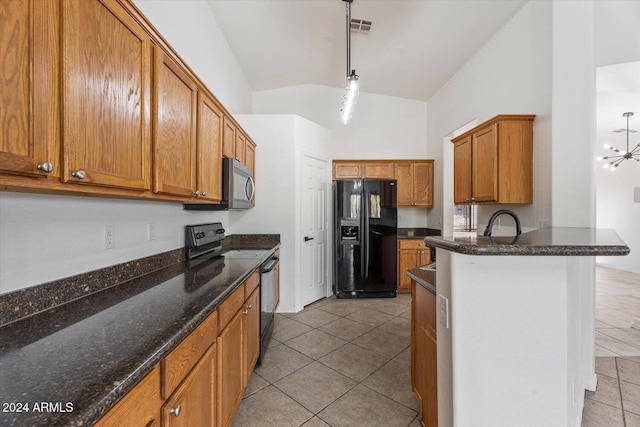 kitchen featuring an inviting chandelier, lofted ceiling, decorative light fixtures, light tile patterned floors, and black appliances