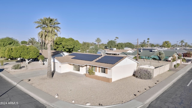 view of front of home featuring solar panels