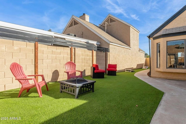 view of yard with an outdoor fire pit