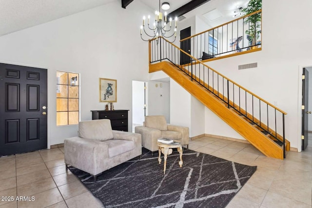 living area featuring light tile patterned flooring, a notable chandelier, visible vents, stairs, and beamed ceiling