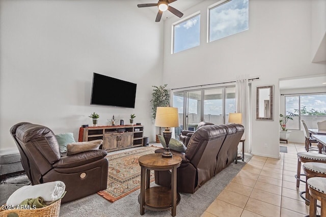 8521 S 67th Dr, Laveen, AZ 85339 - living room featuring a ceiling fan, light tile patterned floors, and a wealth of natural light