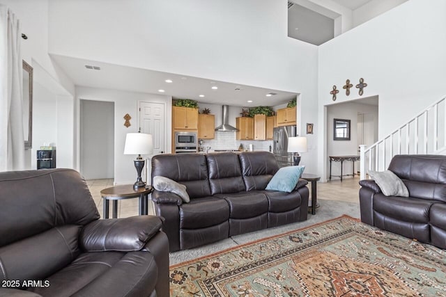 8521 S 67th Dr, Laveen, AZ 85339 - living area featuring a high ceiling, recessed lighting, stairway, and visible vents