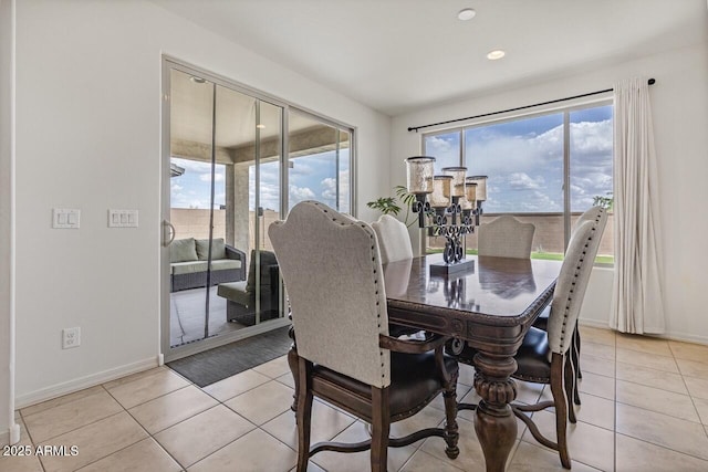 8521 S 67th Dr, Laveen, AZ 85339 - dining area with light tile patterned floors, plenty of natural light, and baseboards