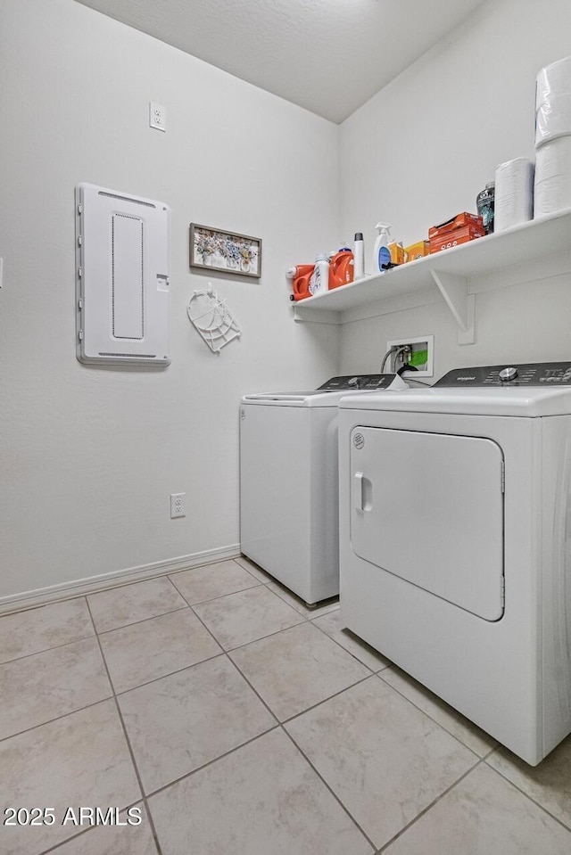 8521 S 67th Dr, Laveen, AZ 85339 - clothes washing area with light tile patterned floors, baseboards, washing machine and clothes dryer, laundry area, and electric panel
