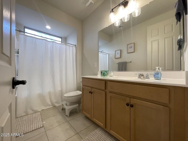 8521 S 67th Dr, Laveen, AZ 85339 - bathroom featuring tile patterned floors, visible vents, toilet, and vanity
