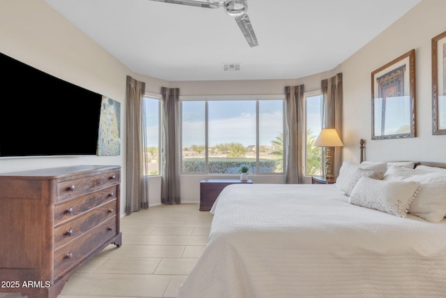 bedroom with light tile patterned floors