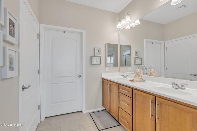 bathroom with vanity and tile patterned flooring