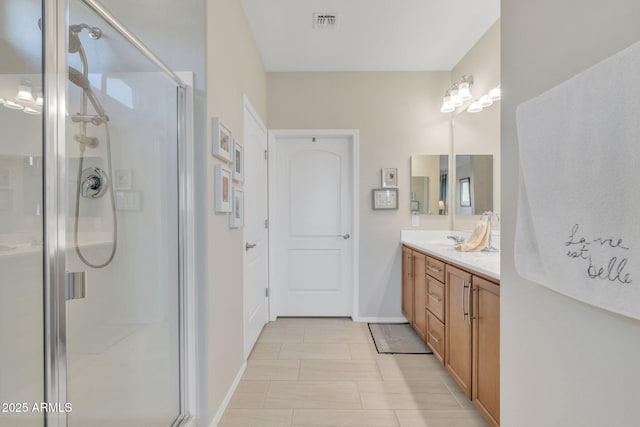 bathroom with vanity and walk in shower