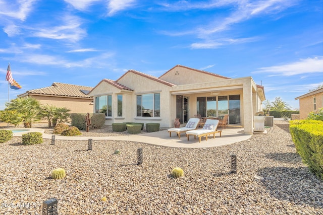 rear view of property with a patio area