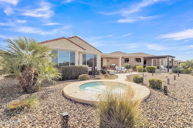 rear view of property with a patio