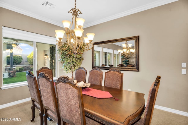 dining room with visible vents, a notable chandelier, carpet flooring, crown molding, and baseboards