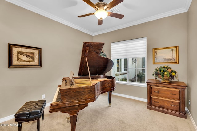 sitting room with baseboards, carpet floors, ornamental molding, and a ceiling fan