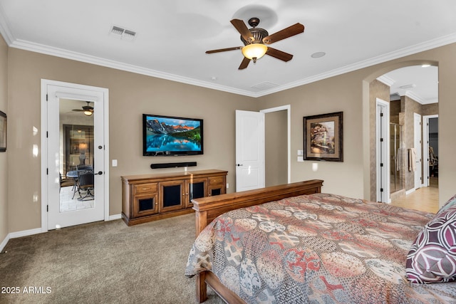 bedroom featuring visible vents, arched walkways, carpet flooring, crown molding, and baseboards