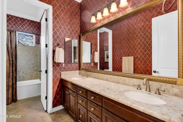 full bath featuring a sink, shower / bath combination with curtain, double vanity, and wallpapered walls