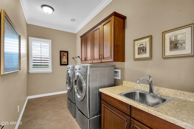 clothes washing area with washing machine and clothes dryer, visible vents, ornamental molding, cabinet space, and a sink