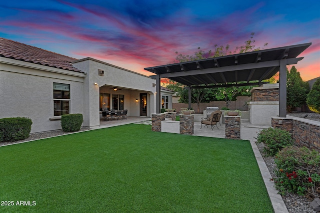 view of yard featuring a patio, an outdoor living space with a fireplace, and fence