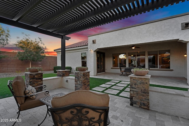 view of patio / terrace with a pergola and fence