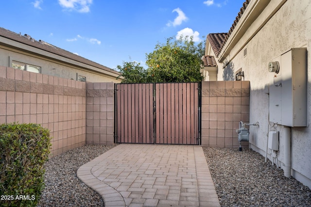 view of gate featuring fence