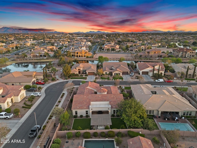 bird's eye view featuring a residential view and a water view