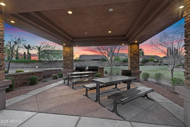 patio terrace at dusk with outdoor dining area