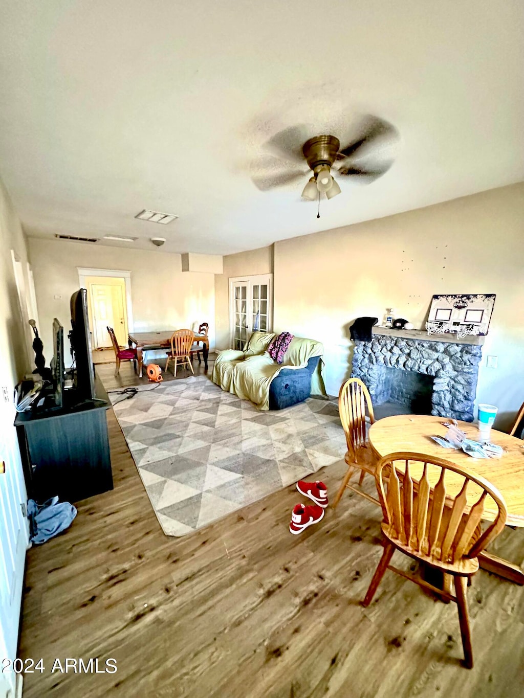 bedroom featuring ceiling fan and hardwood / wood-style flooring