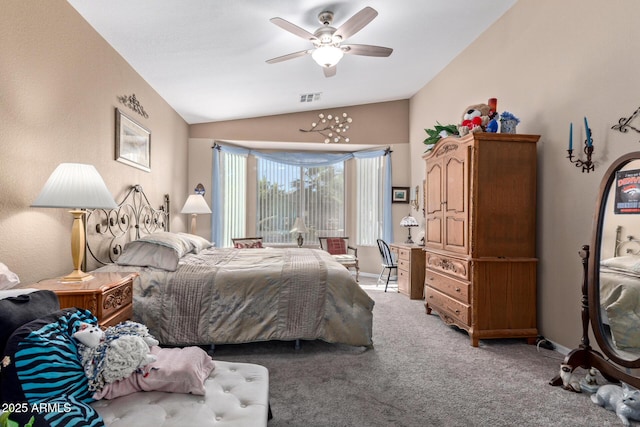 carpeted bedroom with ceiling fan and vaulted ceiling