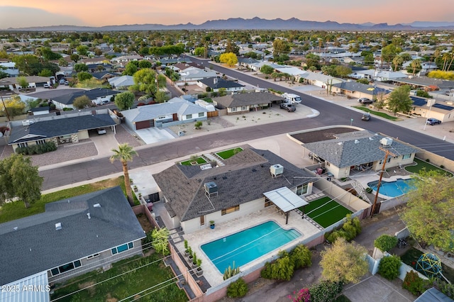 aerial view at dusk with a residential view and a mountain view