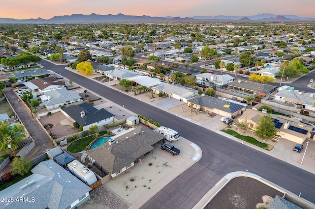 aerial view at dusk with a residential view and a mountain view
