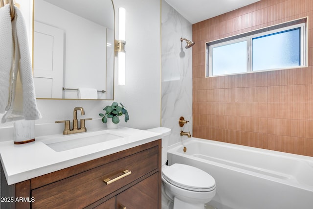 bathroom with vanity, bathtub / shower combination, and toilet
