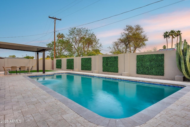view of pool featuring a patio, a fenced in pool, and a fenced backyard