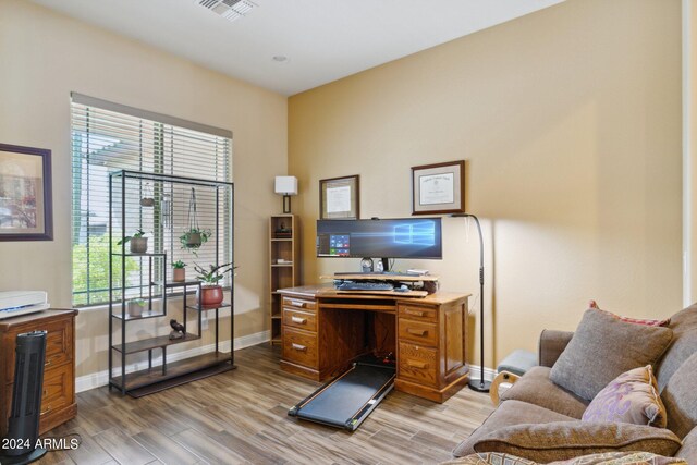 office with light hardwood / wood-style flooring