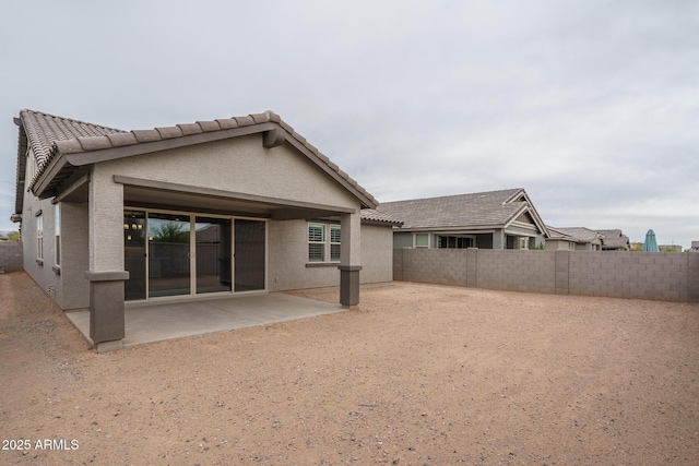 back of property featuring a patio