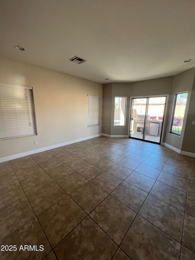 view of tiled spare room