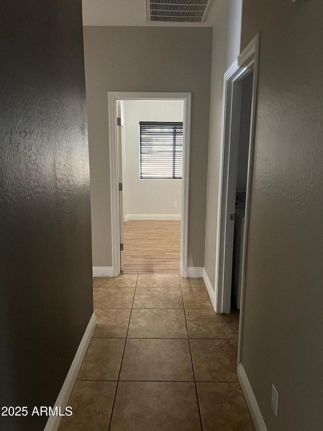 corridor with tile patterned floors