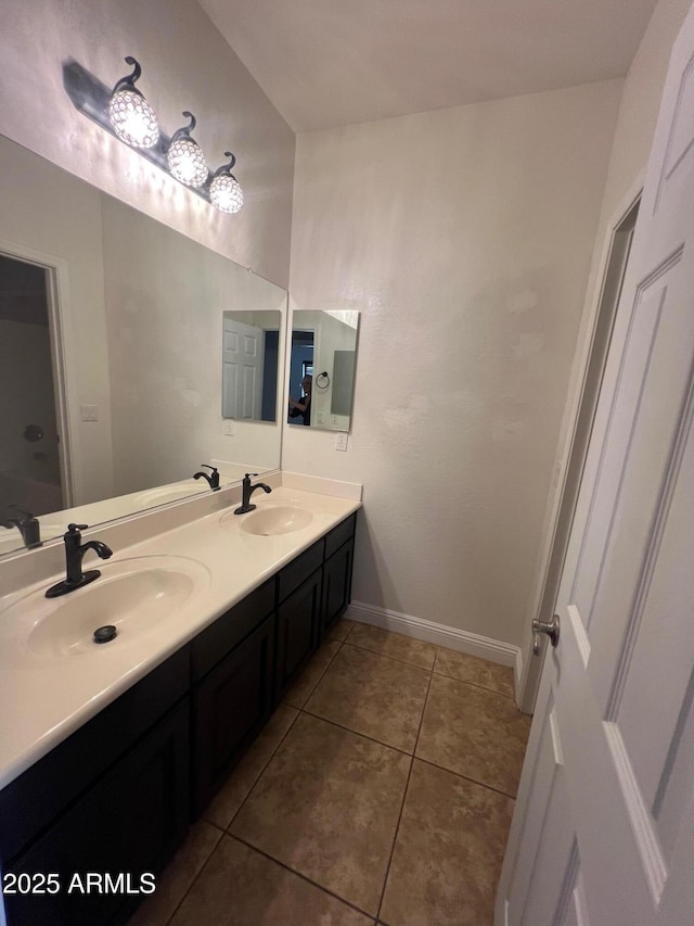 bathroom with tile patterned flooring and vanity