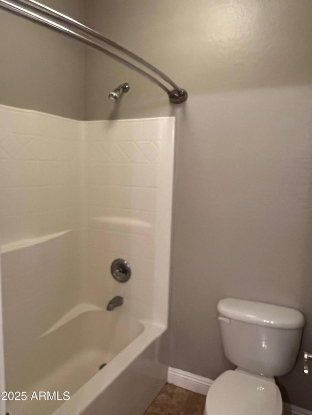 bathroom with  shower combination, toilet, and tile patterned flooring