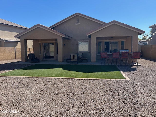 back of property featuring a patio area