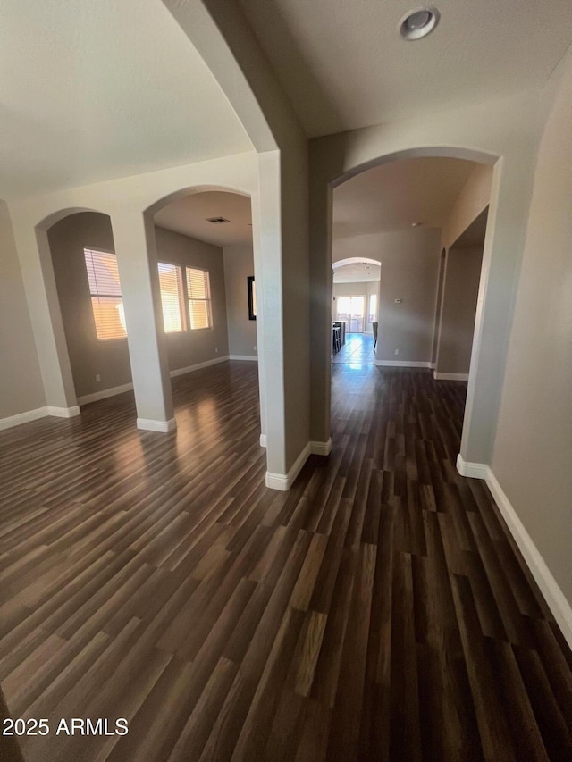 corridor with dark hardwood / wood-style floors