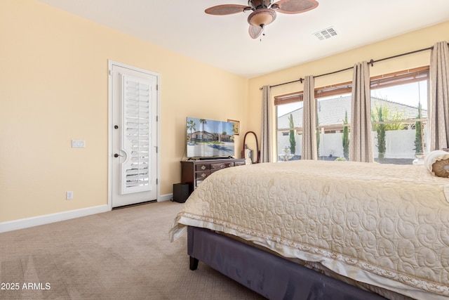 bedroom featuring multiple windows, light colored carpet, visible vents, and access to exterior