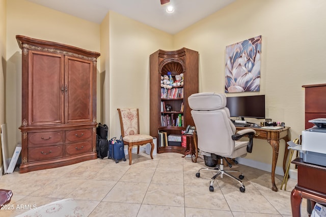 office space featuring light tile patterned floors and baseboards