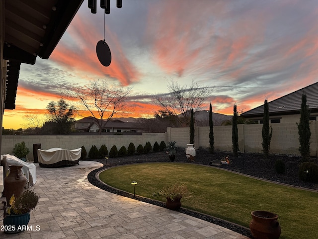 exterior space with a fenced backyard and a yard